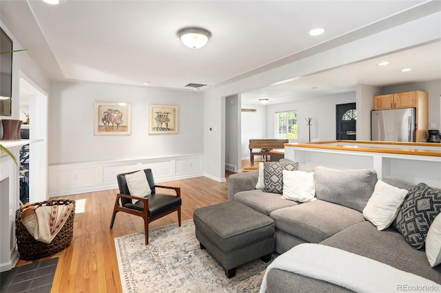 745 S Glencoe St, Denver, CO 80246 - living area with wood finished floors, recessed lighting, and wainscoting