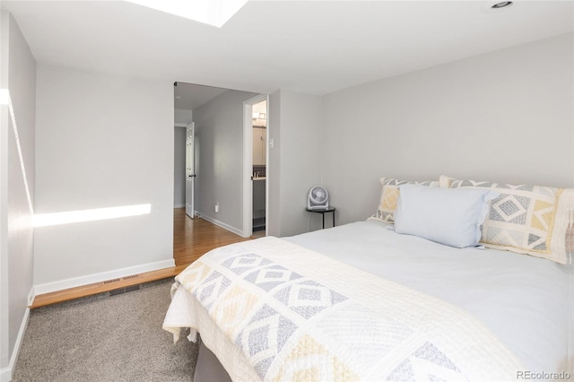 745 S Glencoe St, Denver, CO 80246 - bedroom with baseboards and a skylight