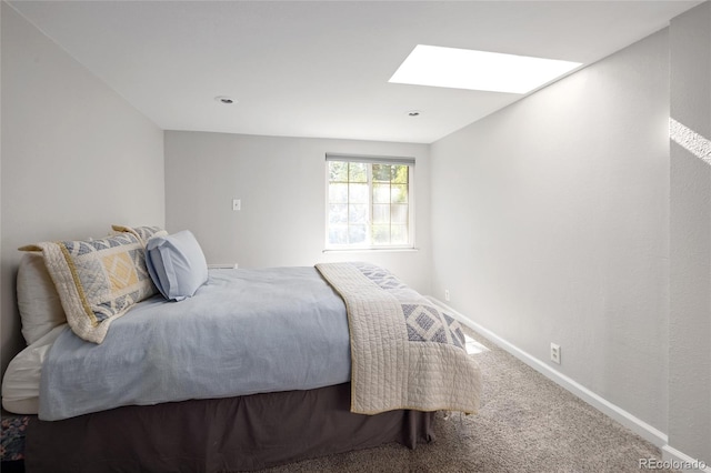 745 S Glencoe St, Denver, CO 80246 - carpeted bedroom featuring a skylight and baseboards