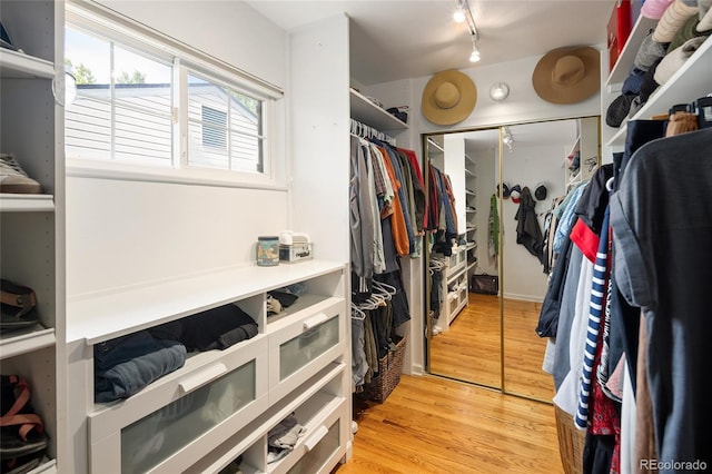 745 S Glencoe St, Denver, CO 80246 - walk in closet with light wood-style floors