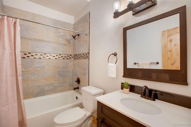 full bathroom featuring shower / tub combo, vanity, and toilet