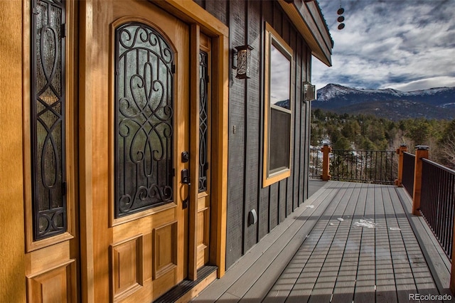 property entrance with a mountain view and a porch