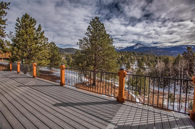 wooden terrace with a mountain view