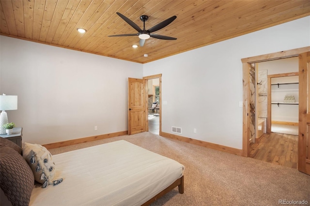 carpeted bedroom with ceiling fan and wooden ceiling