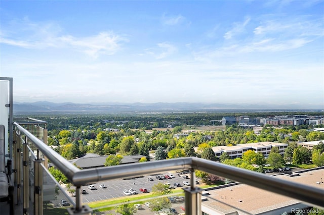 balcony with a mountain view and a city view