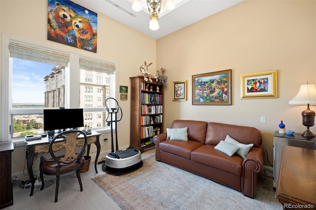 office area featuring light carpet and baseboards