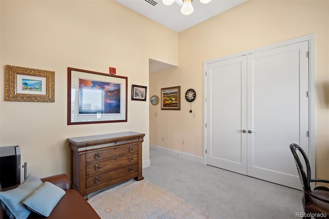 office space featuring light colored carpet and baseboards