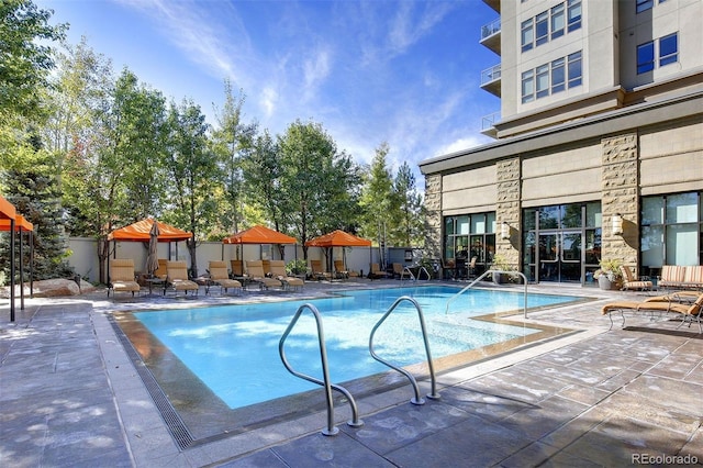 community pool featuring a patio and a gazebo