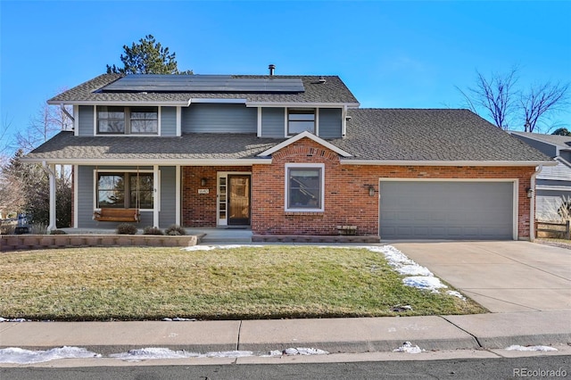 view of property with solar panels, a porch, a garage, and a front yard