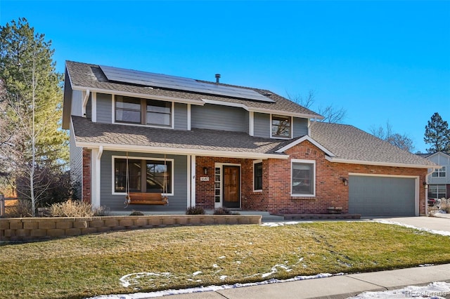 view of front property featuring solar panels, a porch, a garage, and a front lawn