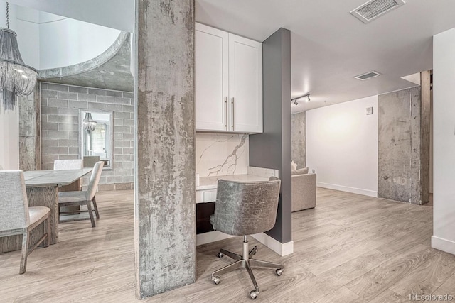 1700 Bassett St Unit 101, Denver, CO 80202 - home office featuring light wood-type flooring and baseboards