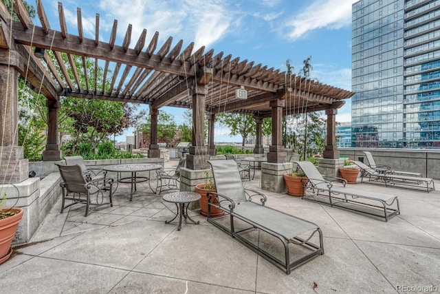 1700 Bassett St Unit 101, Denver, CO 80202 - view of patio with a pergola and outdoor dining area