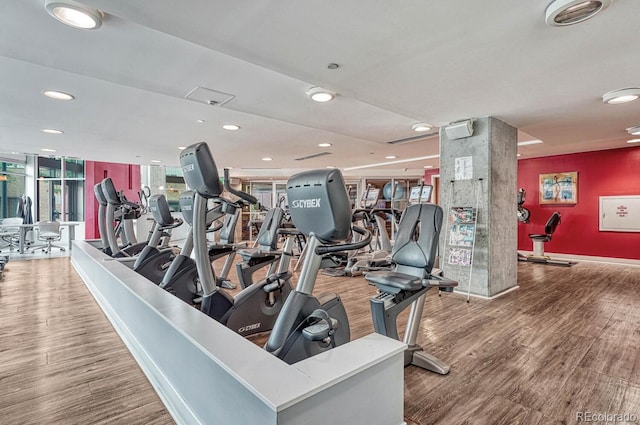 1700 Bassett St Unit 101, Denver, CO 80202 - exercise room featuring wood finished floors, recessed lighting, baseboards, and a wall mounted AC