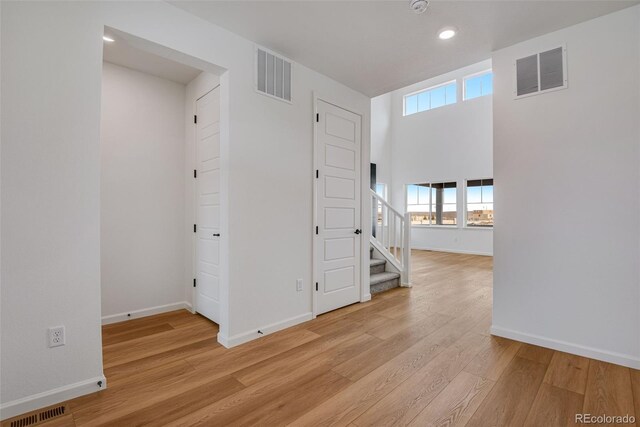 hall featuring light hardwood / wood-style flooring and plenty of natural light