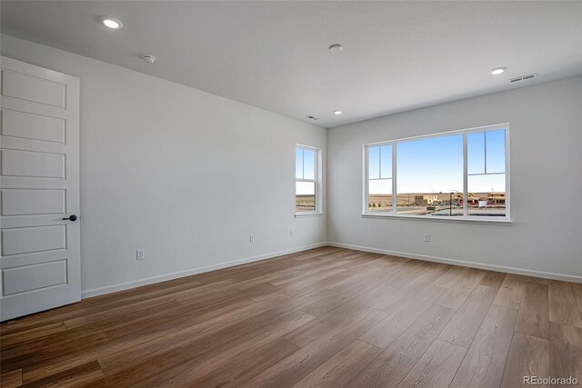 empty room featuring hardwood / wood-style floors