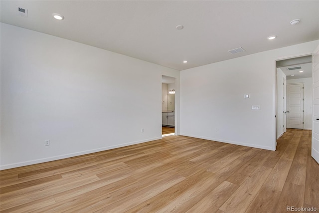 spare room with light wood-type flooring