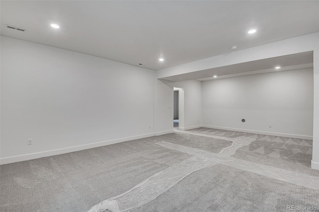 3452 N Gold Bug Ct, Aurora, CO 80019 - finished below grade area with light carpet, recessed lighting, and baseboards