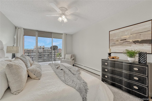 4800 E Hale Pkwy Unit 802N, Denver, CO 80220 - bedroom with a baseboard radiator, a textured ceiling, carpet floors, a wall of windows, and a ceiling fan