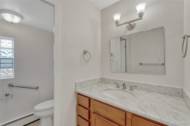 4800 E Hale Pkwy Unit 802N, Denver, CO 80220 - bathroom with a baseboard radiator, vanity, and toilet
