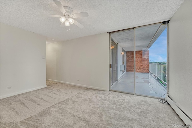 4800 E Hale Pkwy Unit 802N, Denver, CO 80220 - empty room with a baseboard radiator, a wall of windows, carpet floors, a textured ceiling, and a ceiling fan