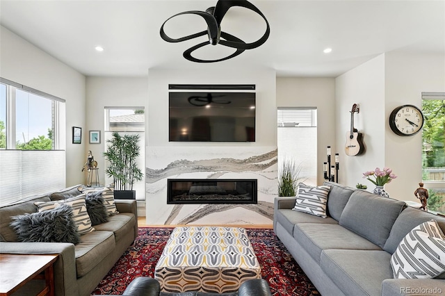2635 Pierce St, Wheat Ridge, CO 80214 - living room featuring a fireplace, recessed lighting, and wood finished floors
