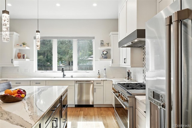 2635 Pierce St, Wheat Ridge, CO 80214 - kitchen featuring stainless steel appliances, open shelves, tasteful backsplash, and recessed lighting