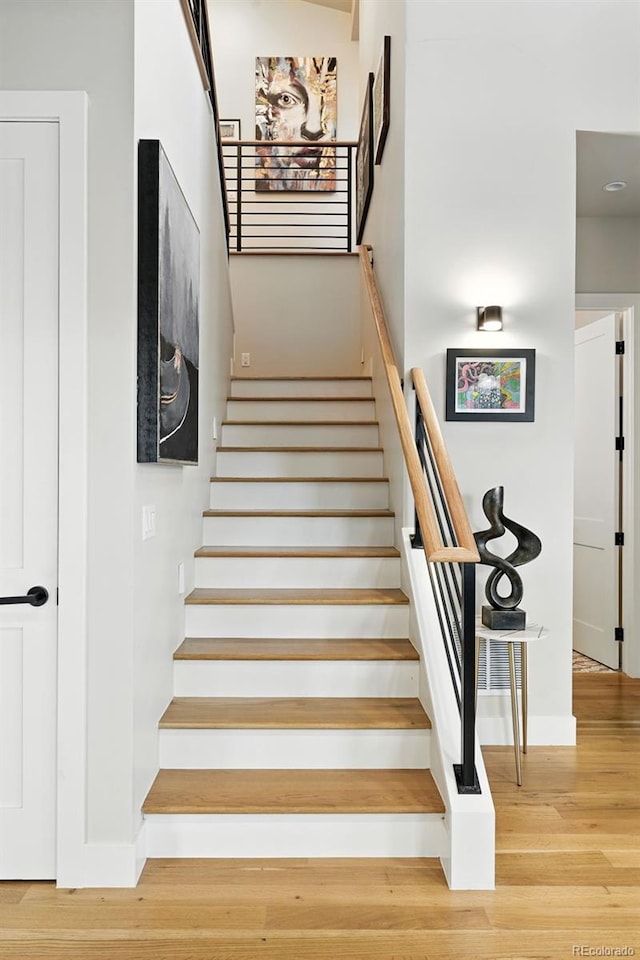 2635 Pierce St, Wheat Ridge, CO 80214 - staircase with wood finished floors and baseboards