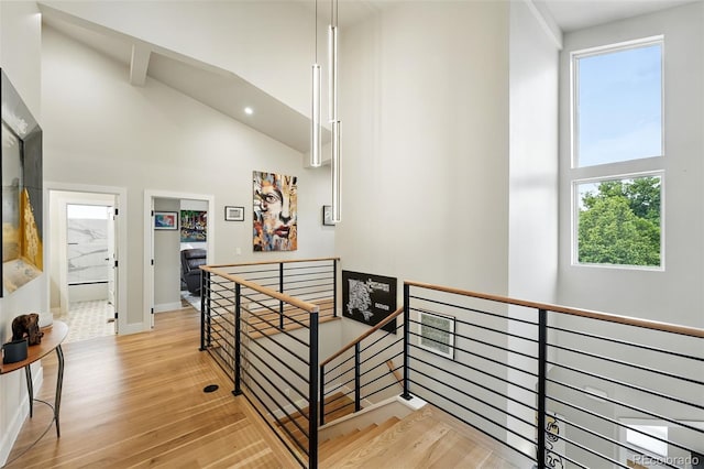 2635 Pierce St, Wheat Ridge, CO 80214 - stairway featuring high vaulted ceiling, wood finished floors, and recessed lighting
