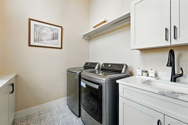 2635 Pierce St, Wheat Ridge, CO 80214 - washroom with washer and clothes dryer, cabinet space, and light tile patterned flooring