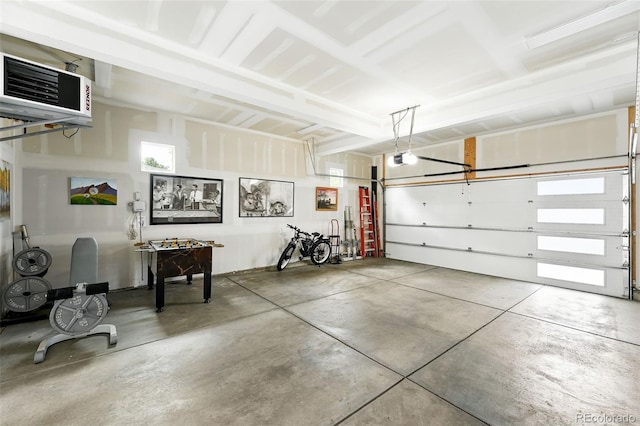 2635 Pierce St, Wheat Ridge, CO 80214 - garage featuring a heating unit and a garage door opener