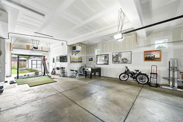 2635 Pierce St, Wheat Ridge, CO 80214 - garage with a storage unit and a garage door opener