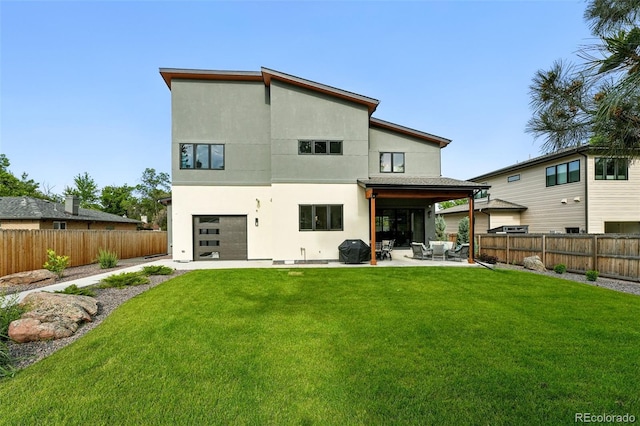 2635 Pierce St, Wheat Ridge, CO 80214 - back of property featuring a patio, a fenced backyard, an attached garage, and stucco siding