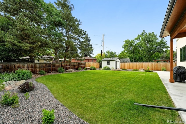 2635 Pierce St, Wheat Ridge, CO 80214 - fenced backyard with a storage shed and a patio