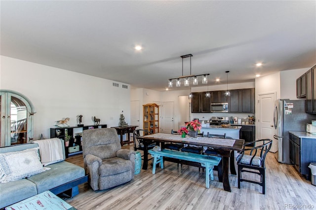 dining room with light wood-type flooring