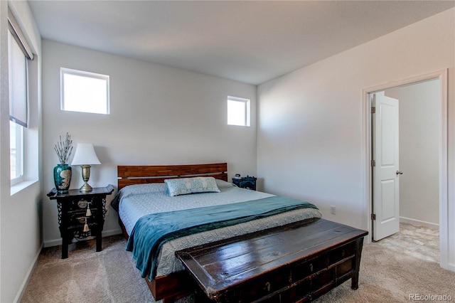 bedroom featuring light colored carpet