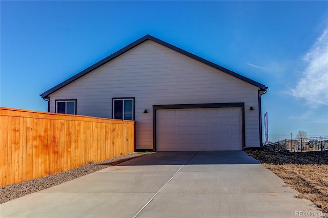 view of side of home with a garage