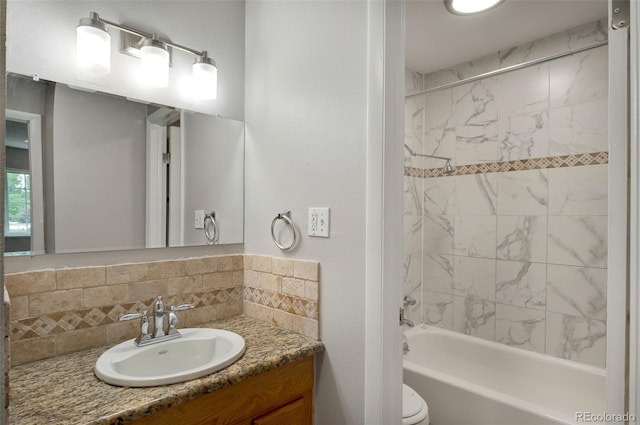 full bathroom with tiled shower / bath combo, decorative backsplash, vanity, and toilet