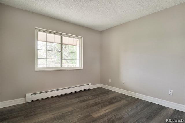 empty room with a textured ceiling, dark hardwood / wood-style floors, and a baseboard radiator