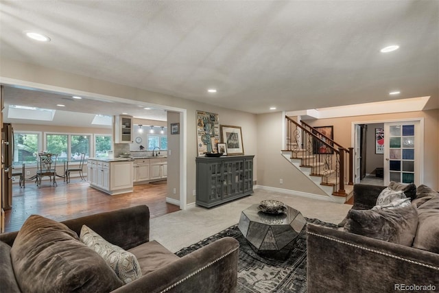 7750 S Glencoe Way, Centennial, CO 80122 - living area featuring stairs, recessed lighting, and light colored carpet