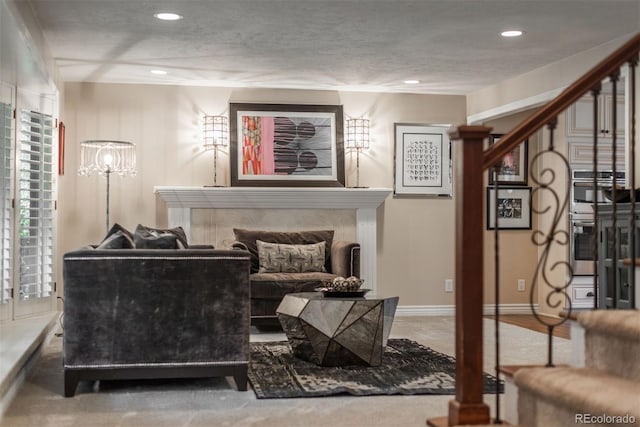 7750 S Glencoe Way, Centennial, CO 80122 - living room with a fireplace, recessed lighting, stairway, and a textured ceiling