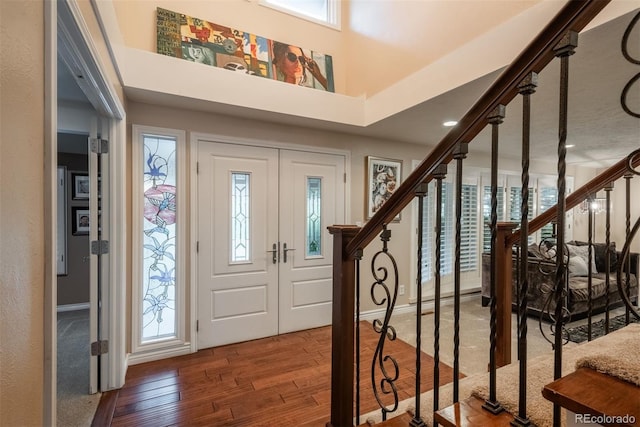 7750 S Glencoe Way, Centennial, CO 80122 - entrance foyer featuring wood finished floors, stairway, and a towering ceiling