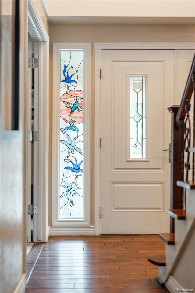 7750 S Glencoe Way, Centennial, CO 80122 - entryway with stairway, wood finished floors, and plenty of natural light