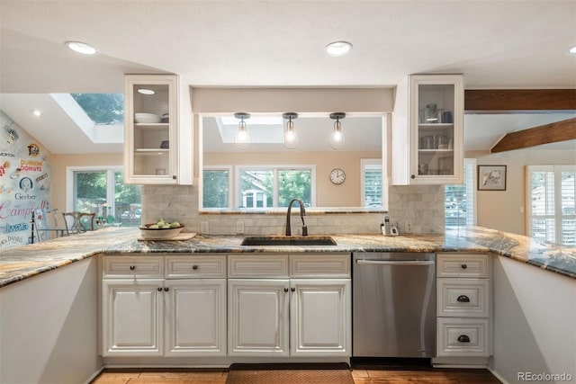 7750 S Glencoe Way, Centennial, CO 80122 - kitchen featuring stainless steel dishwasher, decorative backsplash, white cabinets, light stone counters, and beamed ceiling