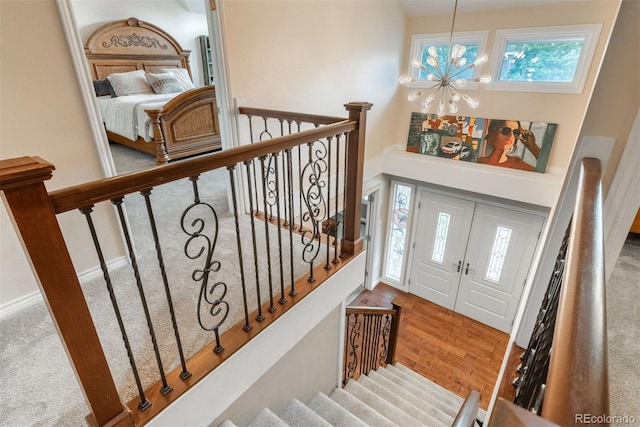 7750 S Glencoe Way, Centennial, CO 80122 - entrance foyer featuring a chandelier, wood finished floors, and stairway