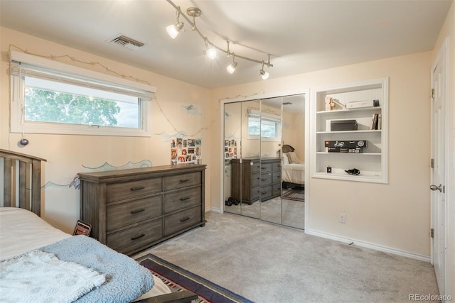 7750 S Glencoe Way, Centennial, CO 80122 - carpeted bedroom with a closet and rail lighting