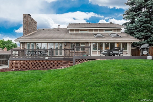 7750 S Glencoe Way, Centennial, CO 80122 - back of house featuring a deck, a chimney, and a tiled roof