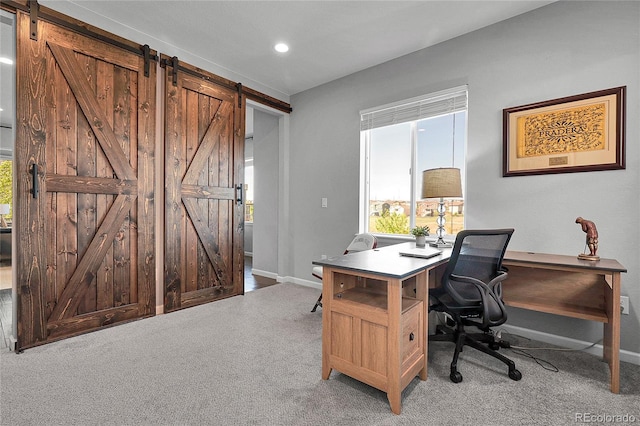 4781 Basalt Ridge Cir, Castle Rock, CO 80108 - carpeted home office with a barn door, healthy amount of natural light, baseboards, and recessed lighting
