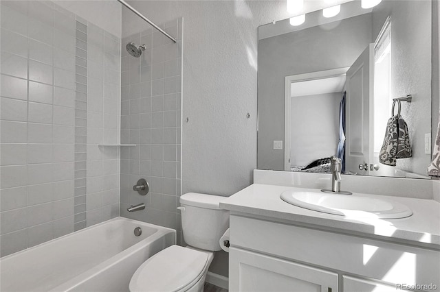 4781 Basalt Ridge Cir, Castle Rock, CO 80108 - ensuite bathroom featuring a textured wall, toilet, vanity, and tub / shower combination