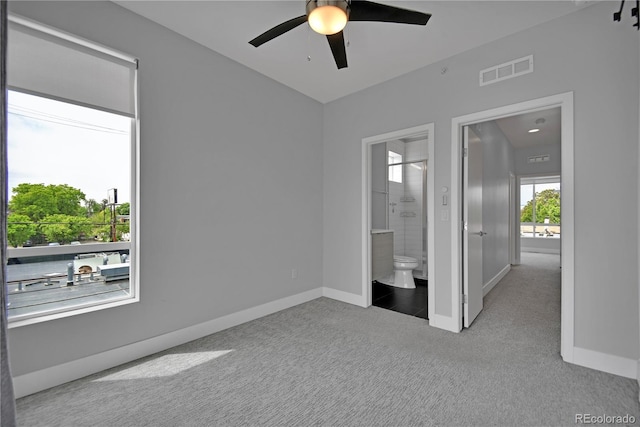3520 W Conejos Pl Unit 14, Denver, CO 80204 - unfurnished bedroom with carpet flooring, baseboards, ensuite bath, and ceiling fan