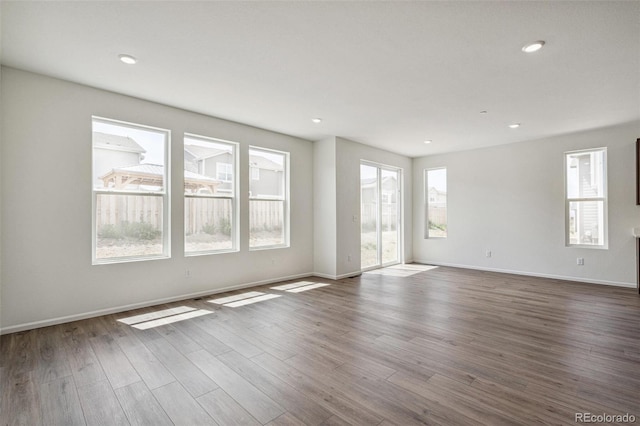 13392 E 110th Way, Commerce City, CO 80022 - spare room with dark wood-style flooring, baseboards, and recessed lighting